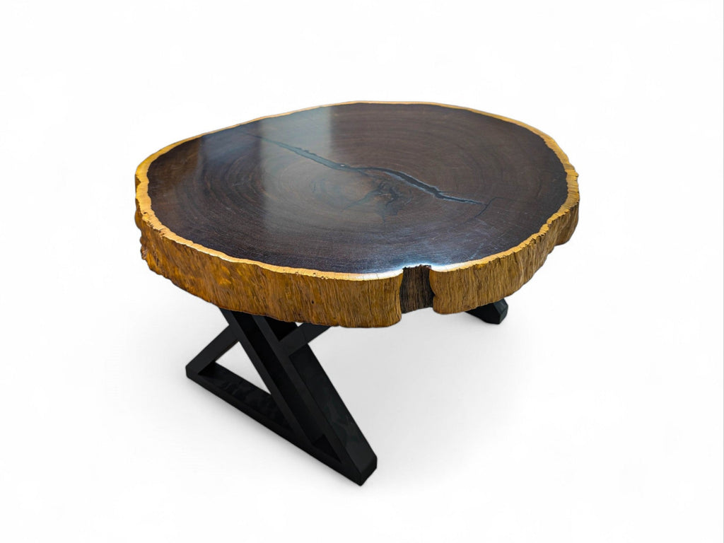 Wooden coffee table with a black metal base on a white background