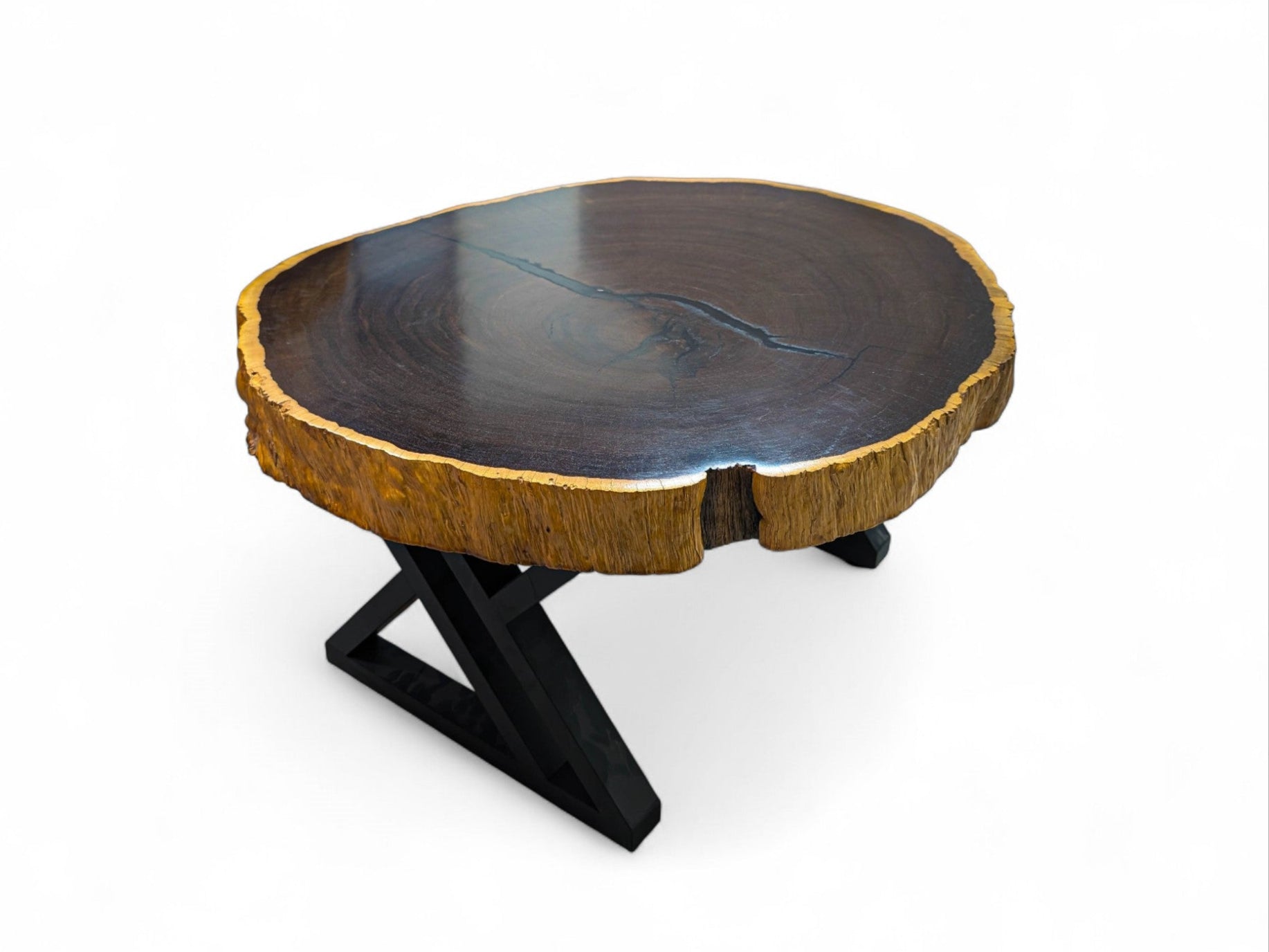 Wooden coffee table with a black metal base on a white background