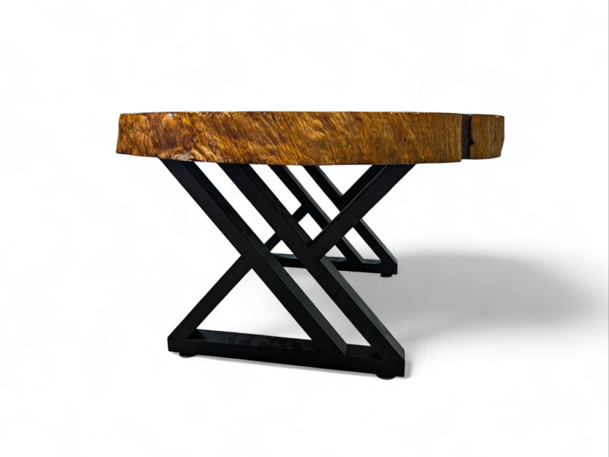 Wooden table with black metal base on a white background