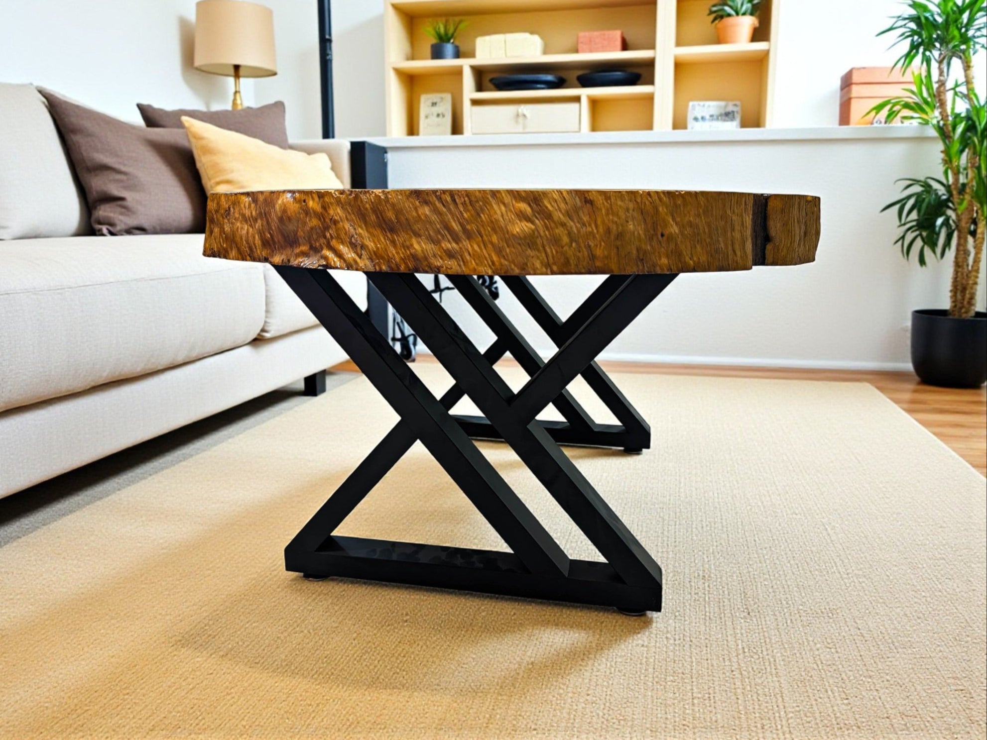 Wooden table with black metal legs in a living room setting