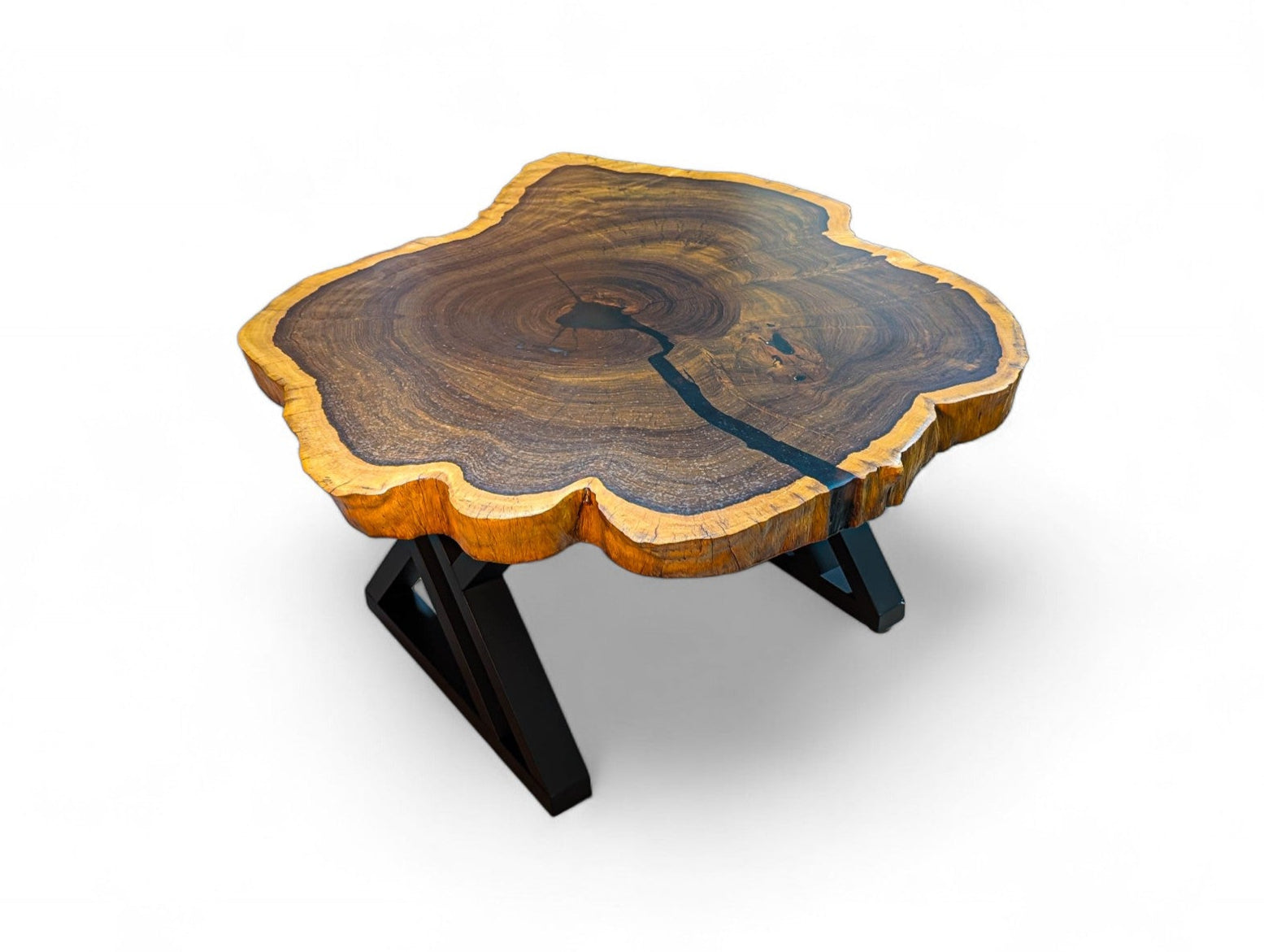 Wooden table with a natural edge design on a white background