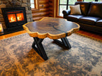 Wooden coffee table in a cozy living room with a fireplace and leather sofa.