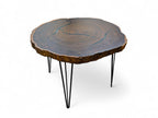 Wooden coffee table with a natural edge design on a white background