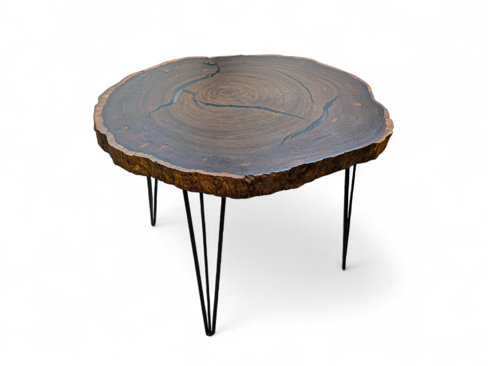 Wooden coffee table with a natural edge design on a white background