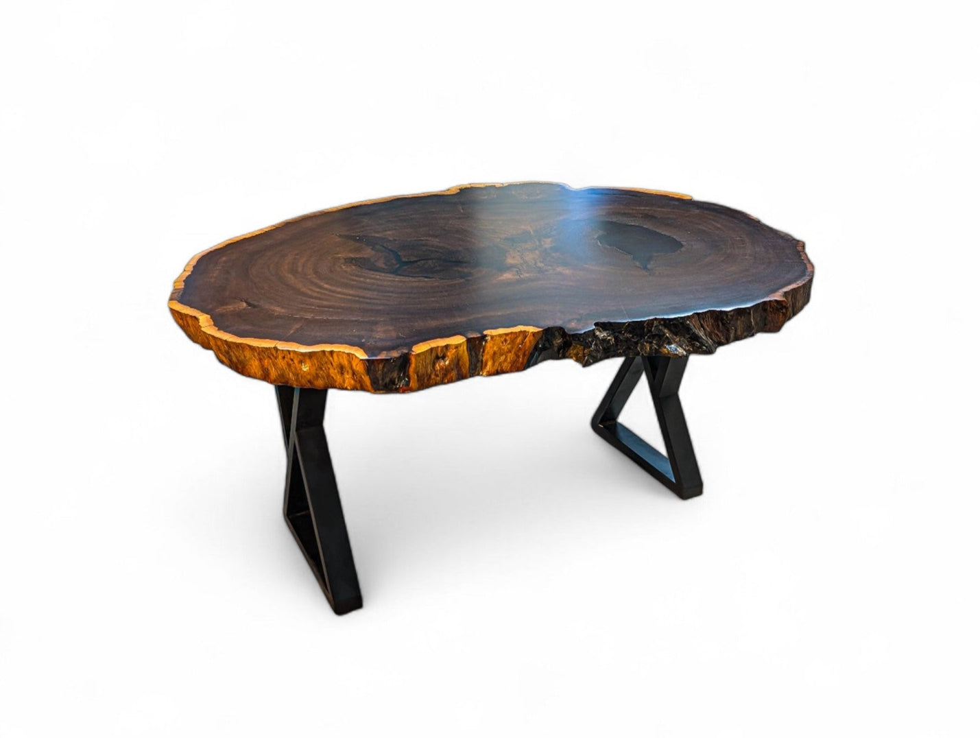 Wooden coffee table with a natural, uneven surface on a white background