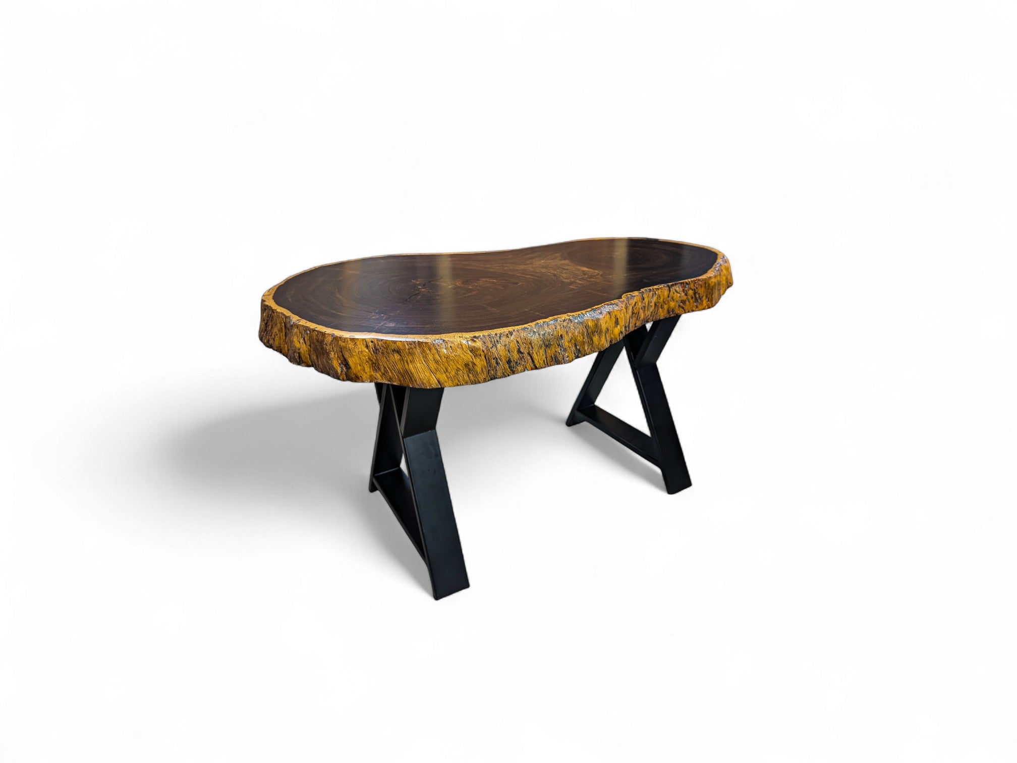 Wooden table with a natural edge design on a white background