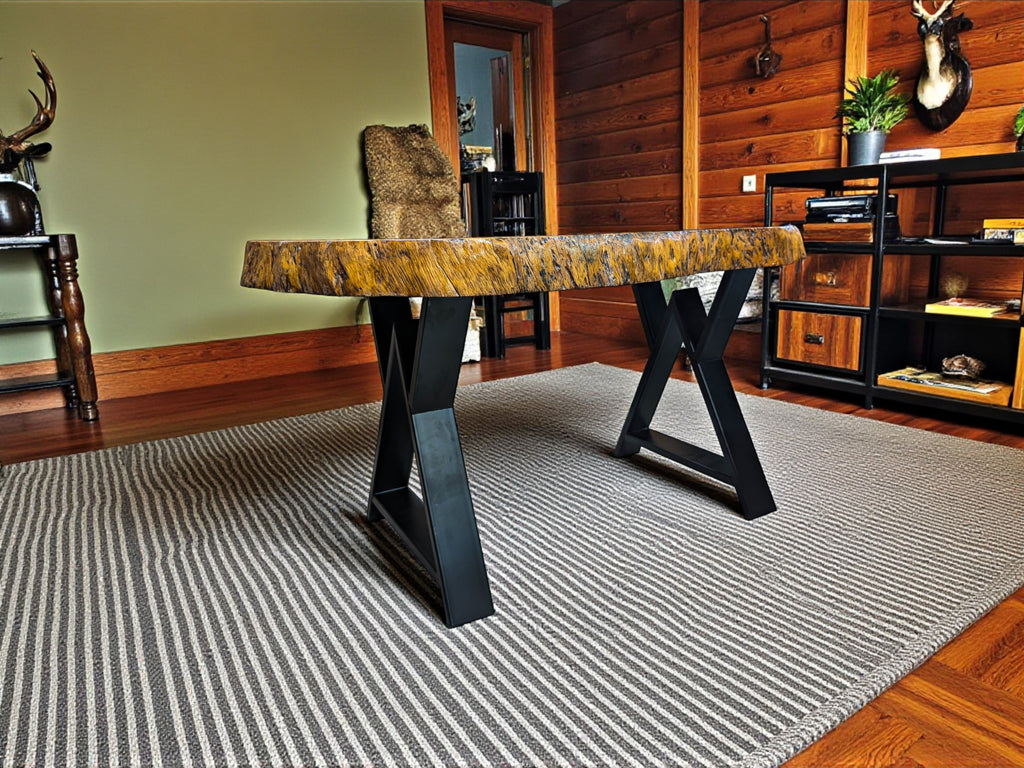 Wooden bench with a textured surface in a room with wooden walls and a rug.