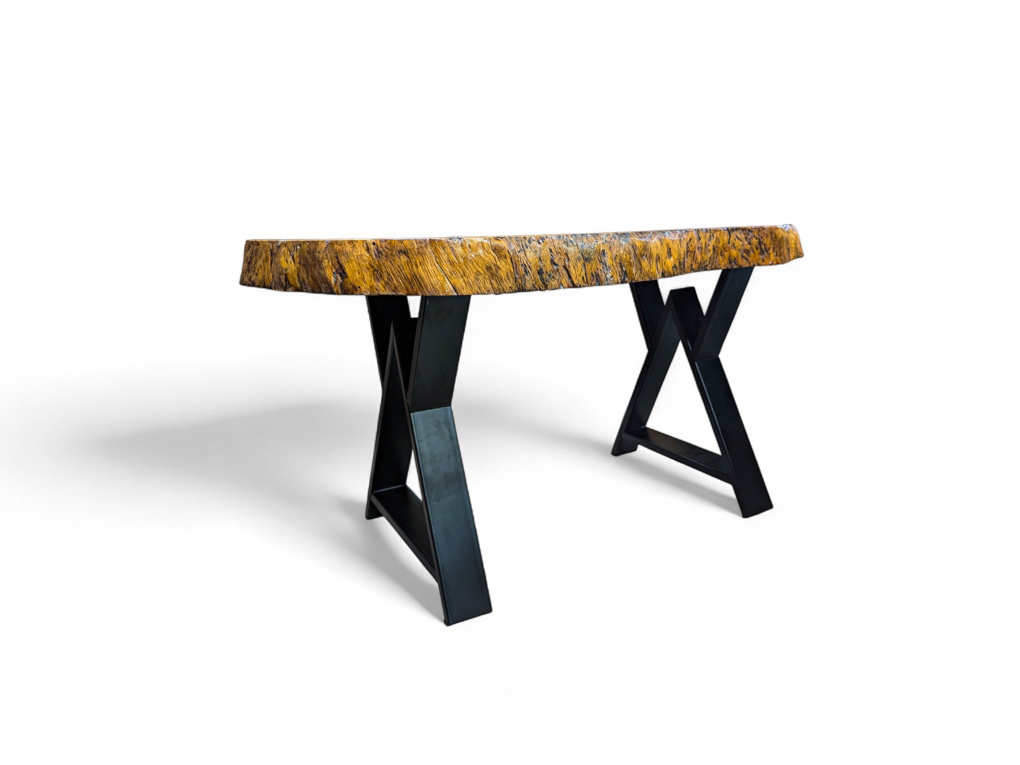 Round wooden table with black metal legs on a white background