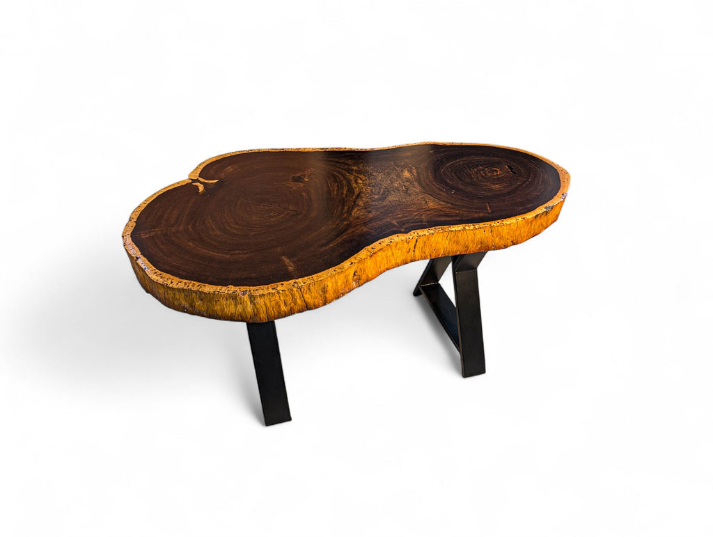 Wooden coffee table with a natural, uneven surface on a white background