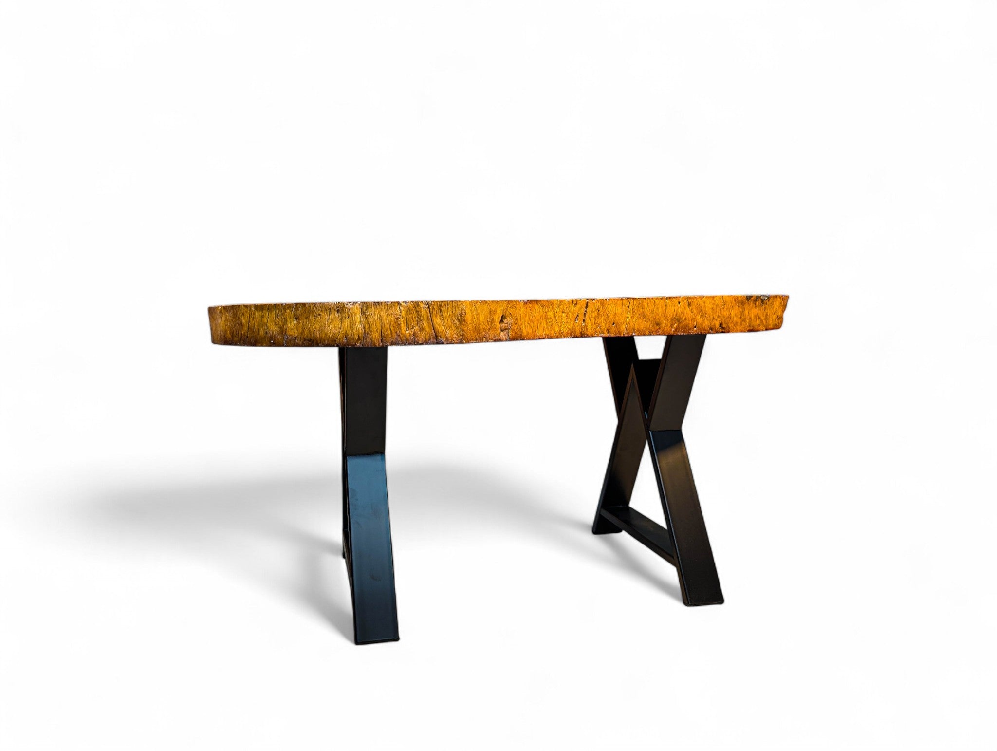 Round wooden table with a natural finish on a white background