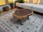 Wooden coffee table with a natural finish in a living room setting.