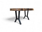 Coffee table with a rustic wooden top and black metal legs on a white background