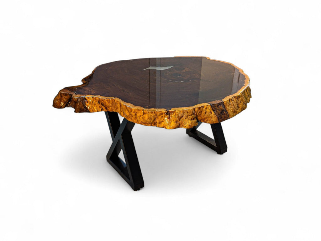 Wooden coffee table with a natural edge design on a white background