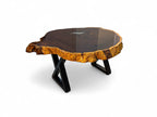 Wooden coffee table with a natural edge design on a white background
