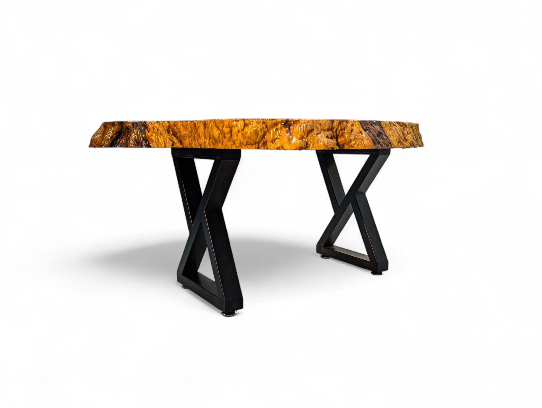 Coffee table with a burl wood top and black metal base on a white background