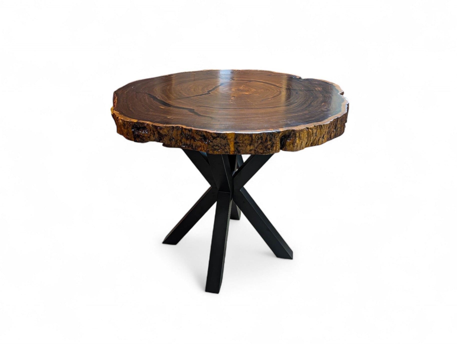 Wooden table with a natural edge on a white background