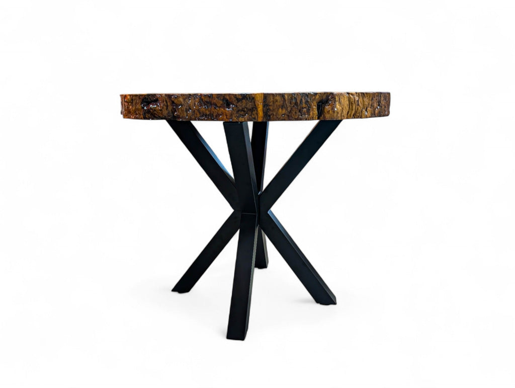 Small table with wooden top and black metal legs on a white background