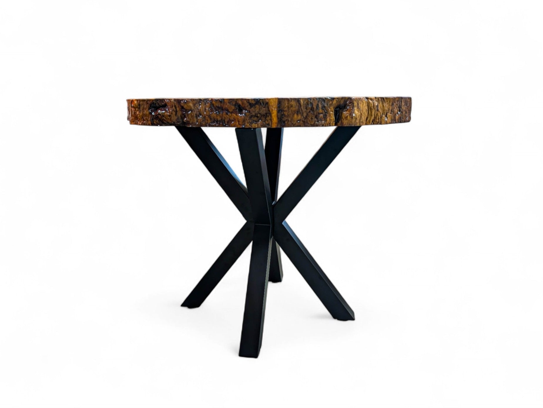 Small table with wooden top and black metal legs on a white background