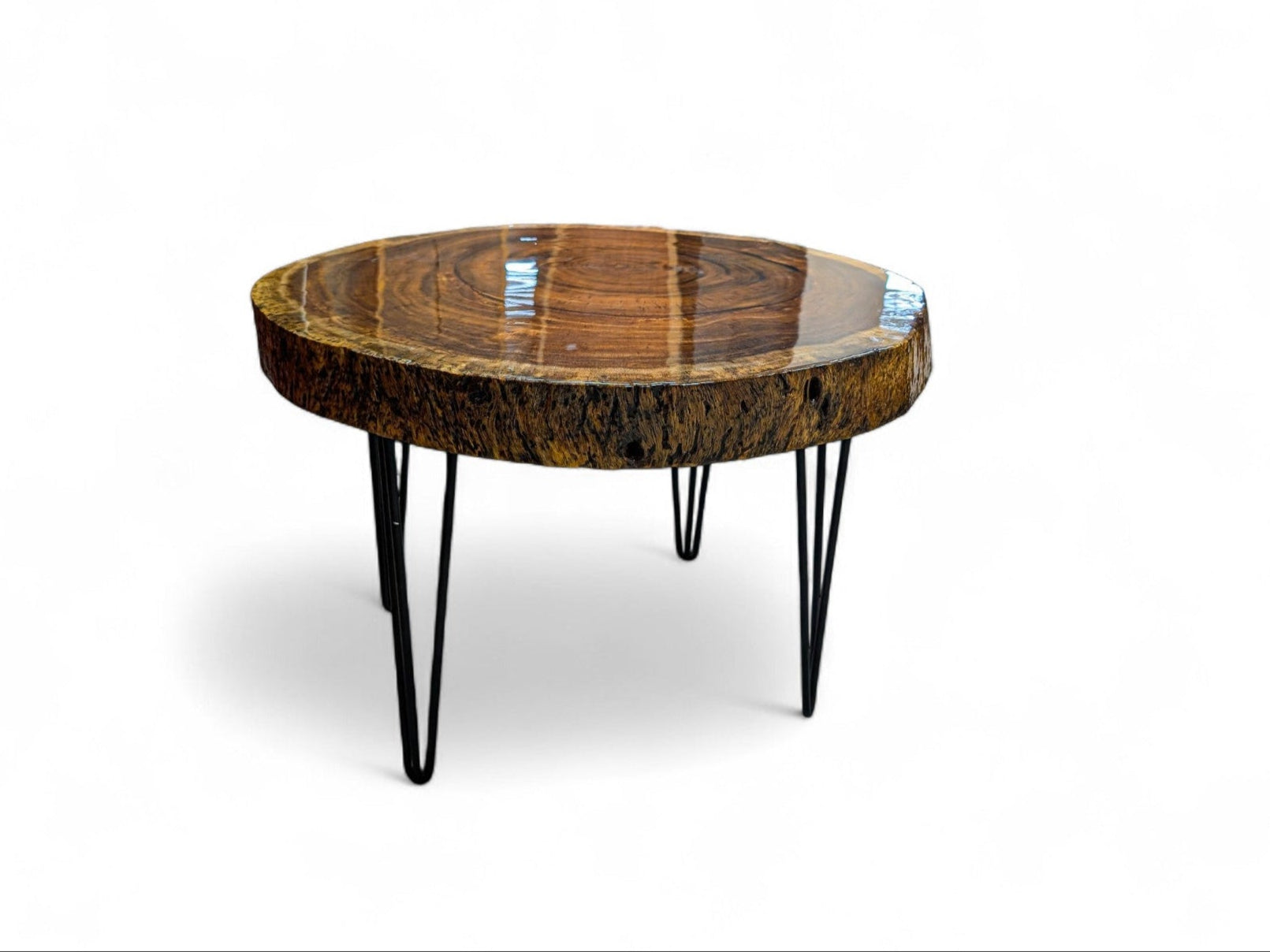 Round wooden table with a natural finish and metal legs on a white background