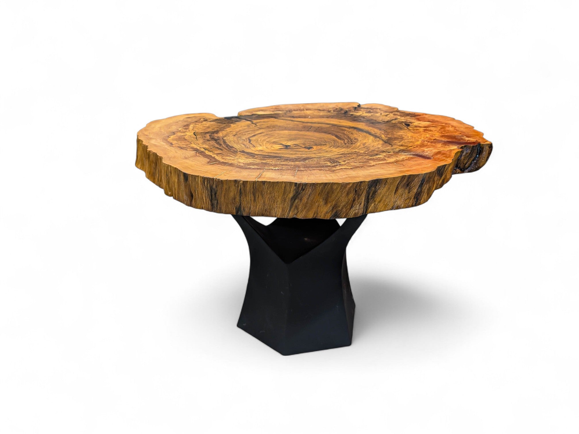 Wooden table with a black base on a white background