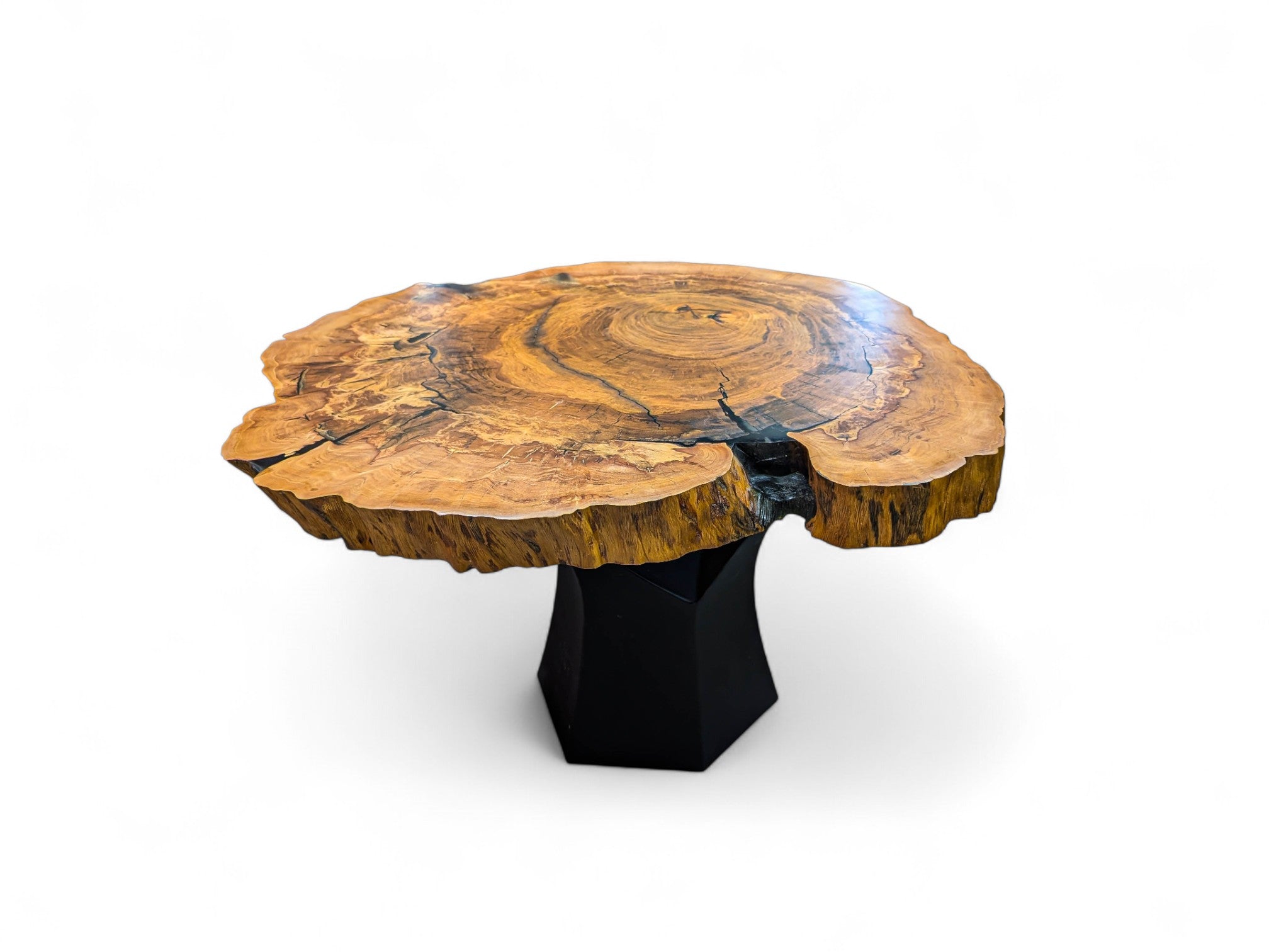 Wooden table with a black base on a white background